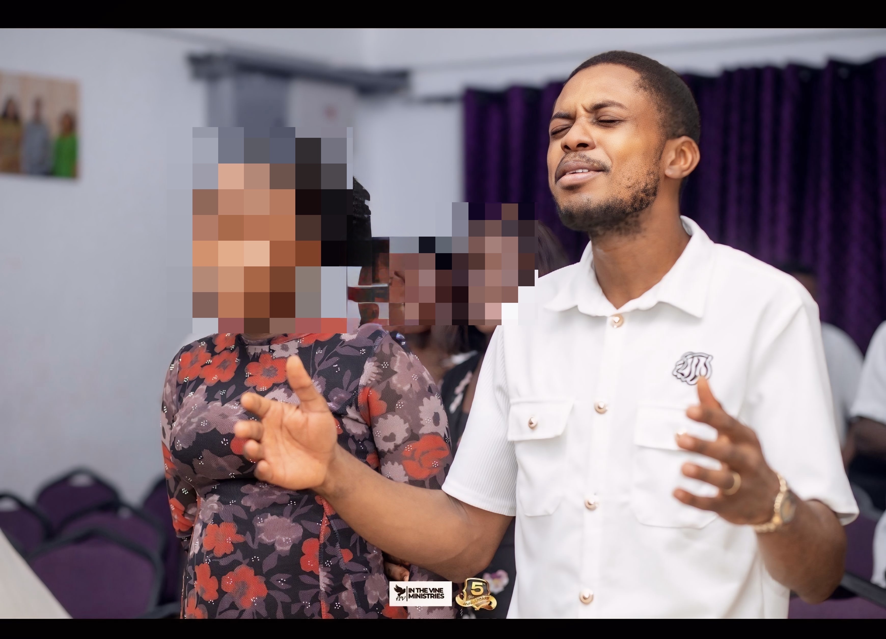 Pastor Samuel A. Ewool during prayer ministry