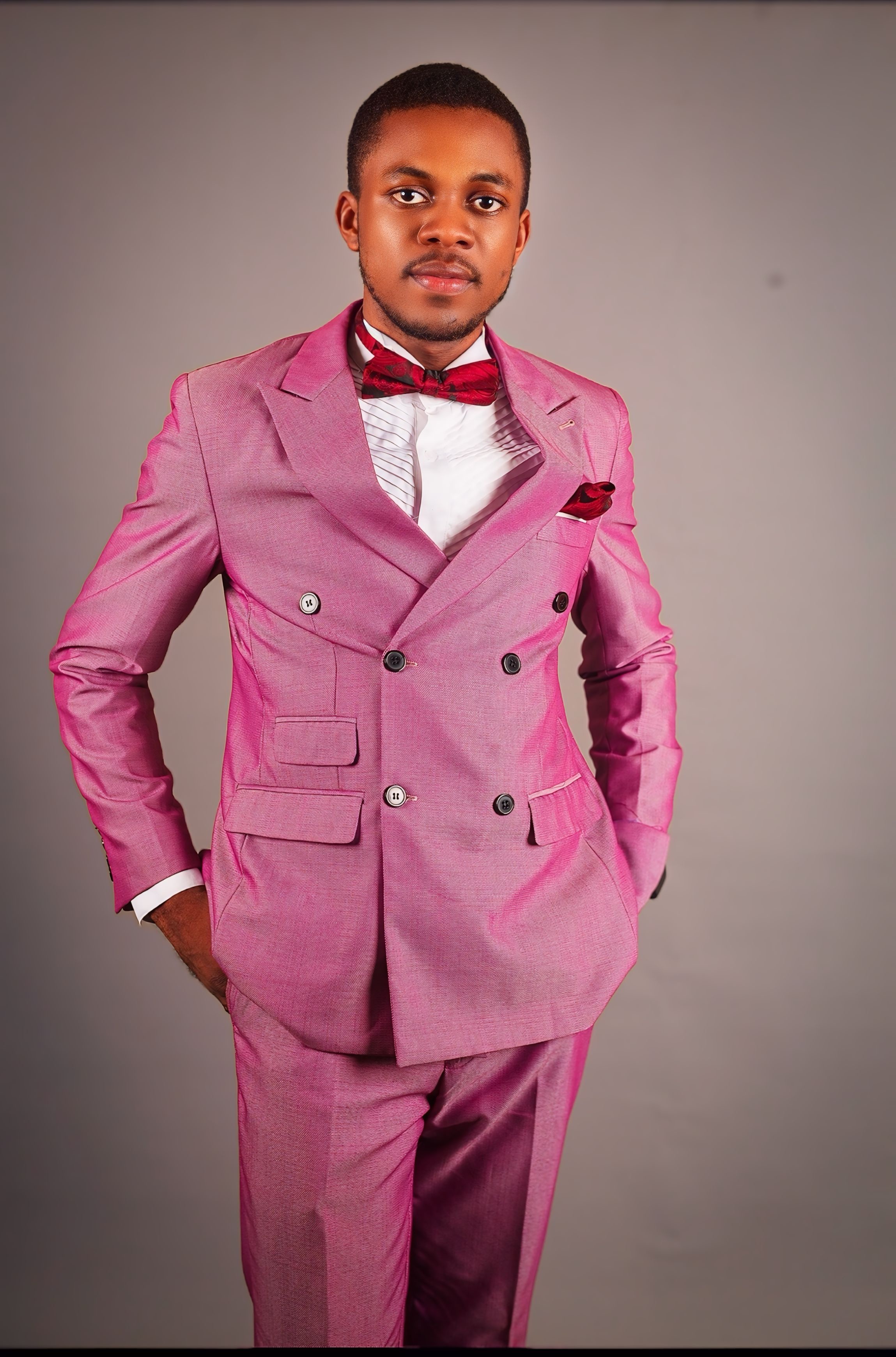 Pastor Samuel A. Ewool formal pink suit portrait