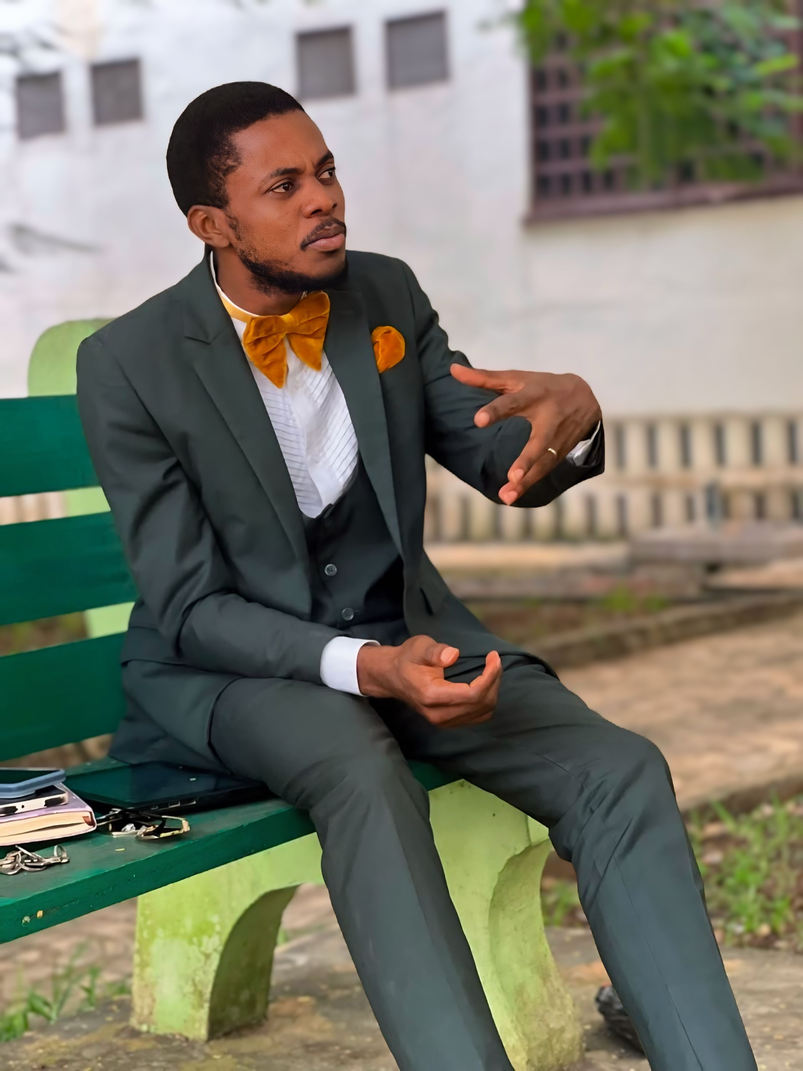 Pastor Samuel A. Ewool seated outdoors